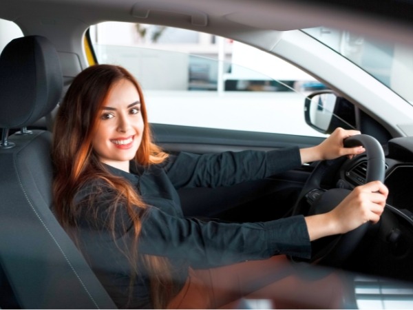 Woman Driving a Rental Car