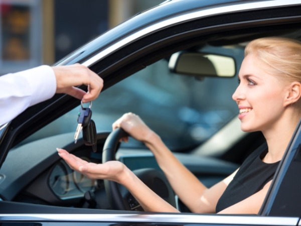 Woman Receiving Car Keys