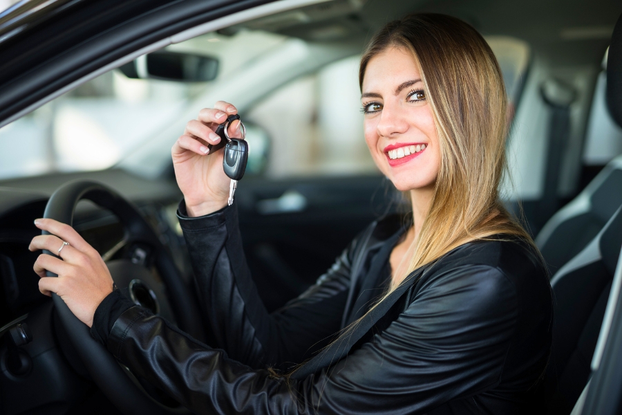 Woman Driving a Black Car